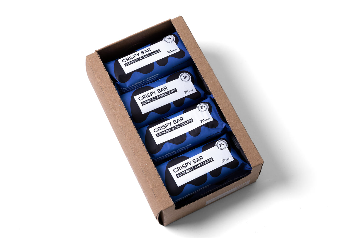 Box geöffnet: Geöffnete LIKA CRISPY BAR Espresso & Chocolate Box mit Blick auf vier verpackte Riegel