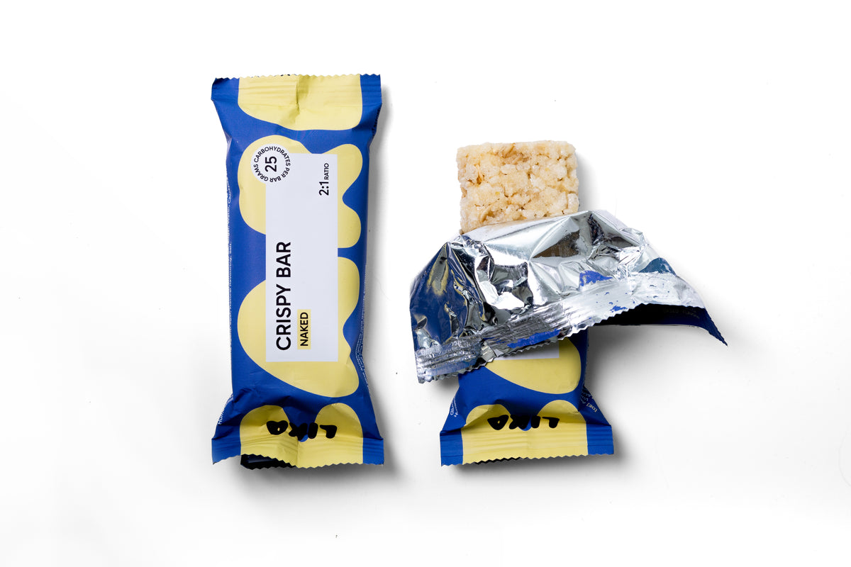 Naked geöffnet: LIKA CRISPY BAR Naked, geöffneter Riegel mit Blick auf die crispy Reistextur